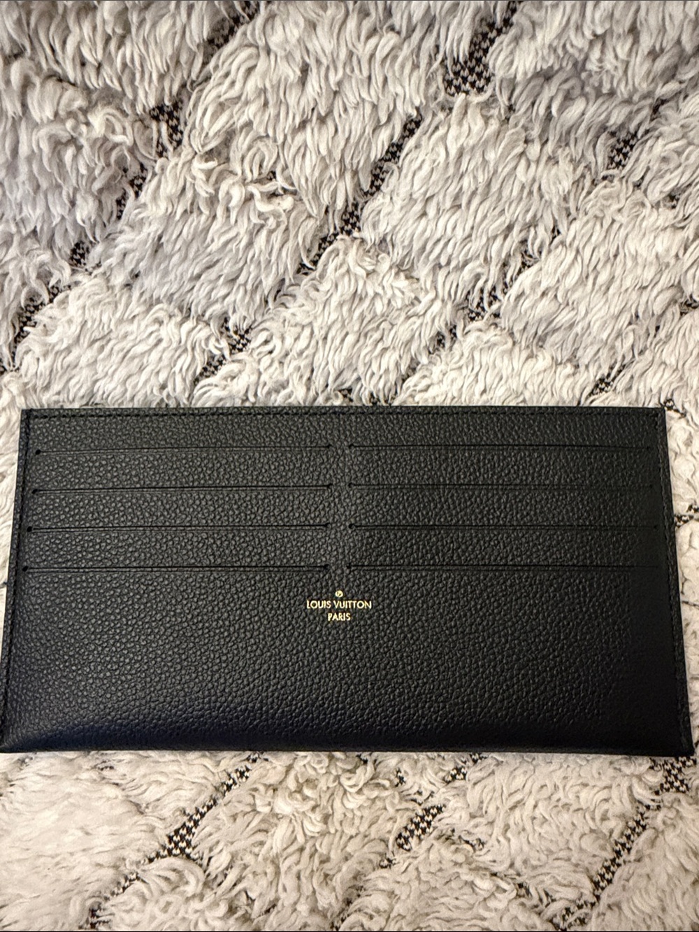 Card holder likely a money clip or key/card holder